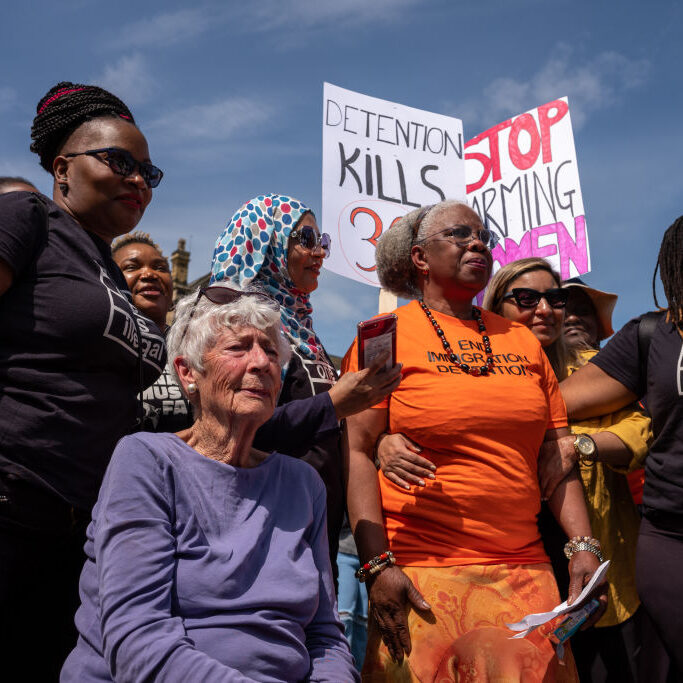 Protesters Gather To Demonstrate Against The Derwentside Immigration And Removal Centre DURHAM, ENGLAND - MAY 14: Agnes Tanoh (C) reacts after delivering her speech on refugee women as protestors gather in Durham to demonstrate against the Derwentside Immigration and Removal Centre on May 14, 2022 in Durham, England. The Derwentside Immigration and Removal Centre, formerly the site of the Hassockfield Secure Training Centre, replaced the Yarl's Wood facility in Bedford and will hold up to 80 foreign nationals prior to deportation. Durham County Council objected to its opening because it is going ahead instead of a major housing plan, following the site's acquisition by the Home Office. The Government have said it will hold both foreign national offenders and immigration offenders while awaiting deportation and removal from the UK. (Photo by Ian Forsyth/Getty Images)
